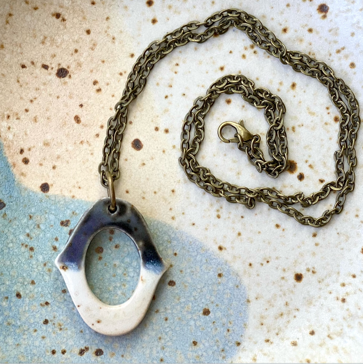 Black oval medallion necklace